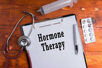 A clipboard with the words \&quot;Hormone Therapy\&quot; written on it